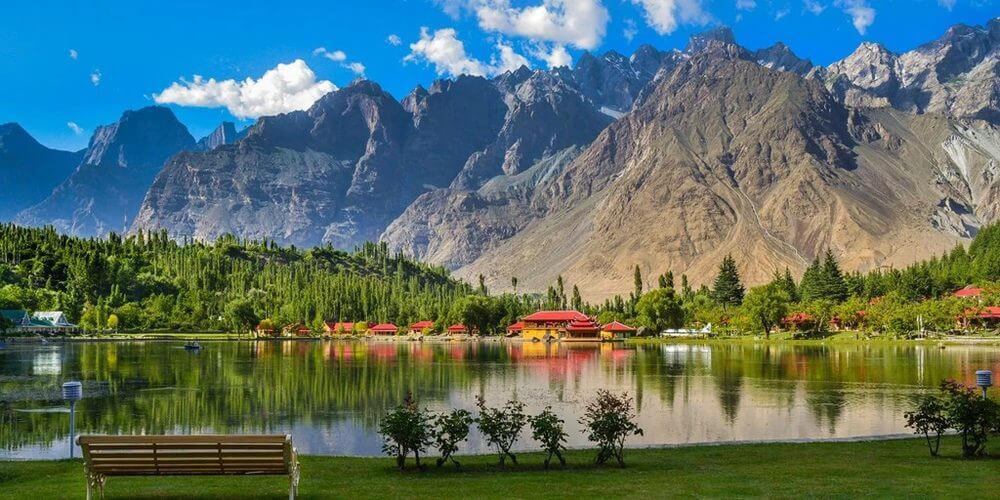 Lakeside cottages with red roofs below the Karakoram, Skardu