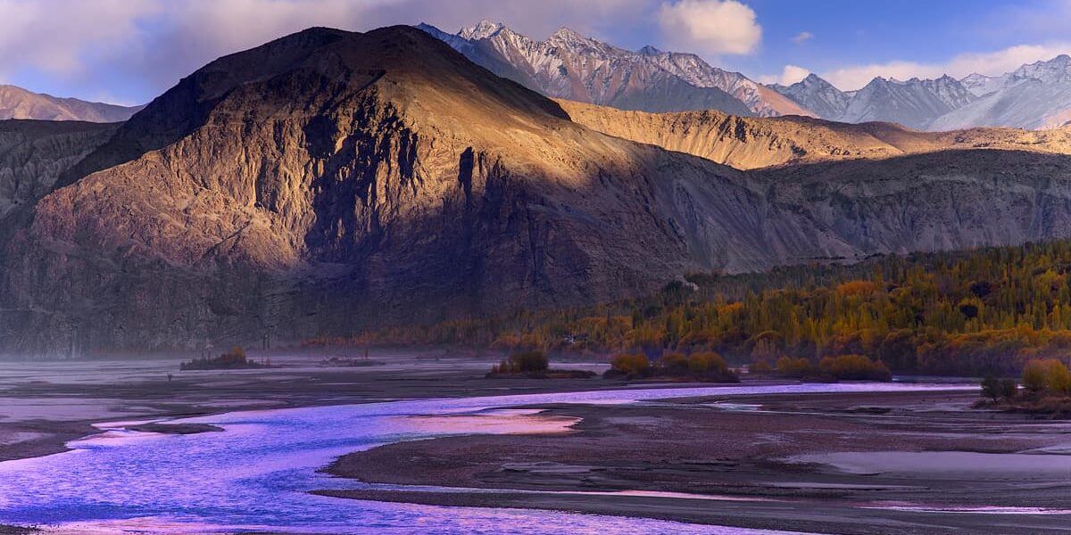 Braided river below snow peaks at dawn in autumn, Skardu, Gilgit-Baltistan