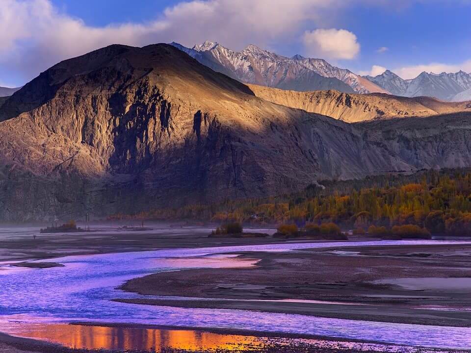 Braided river below snow peaks at dawn in autumn, Skardu, Gilgit-Baltistan